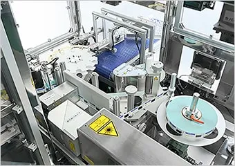 CO2レーザーマーカーLinx CSL30/60 用途事例(バイアル瓶胴巻きラベラー)